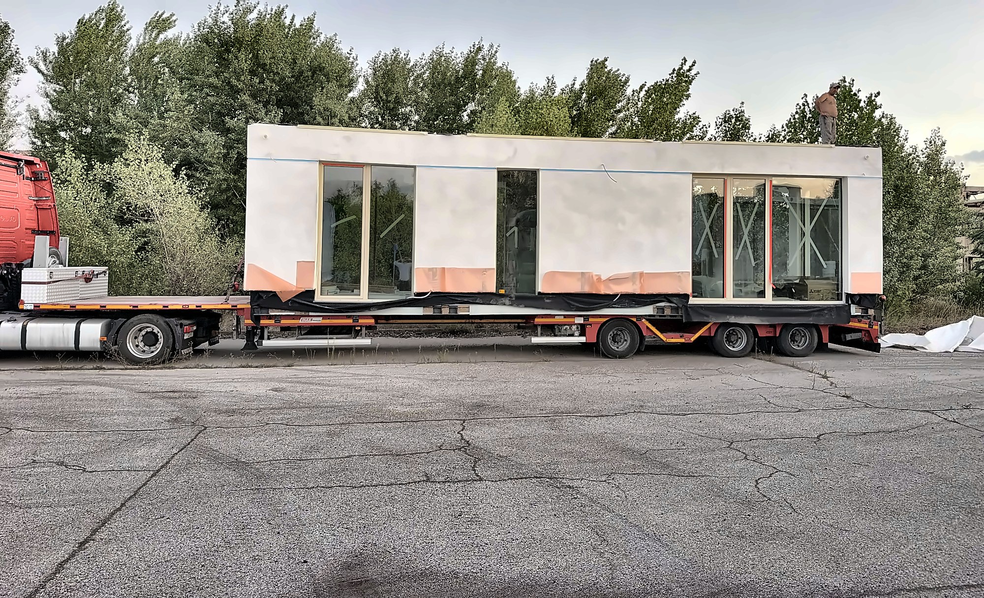 A finished module loaded on a flatbed trailer, ready for delivery